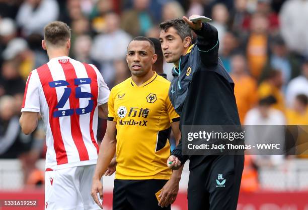 Wolverhampton Wanderers manager Bruno Lage gives instructions to Marcal of Wolverhampton Wanderers during the pre-season friendly match between Stoke...