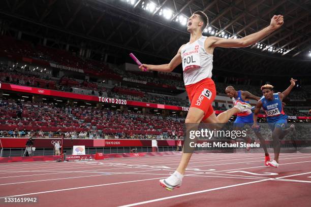 Kajetan Duszynski of Team Poland celebrates after crossing the finishing line to win gold in the 4 x 400m Mixed Relay Final on day eight of the Tokyo...