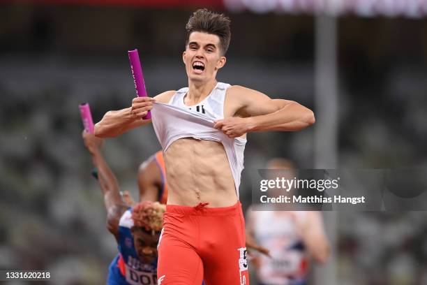 Kajetan Duszynski of Team Poland celebrates after crossing the finishing line to win gold in the 4 x 400m Mixed Relay Final on day eight of the Tokyo...
