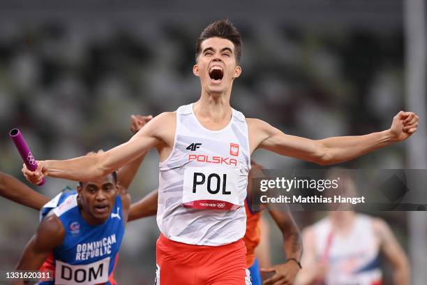 Kajetan Duszynski of Team Poland celebrates after crossing the finishing line to win the gold medal in the 4 x 400m Mixed Relay Final on day eight of...