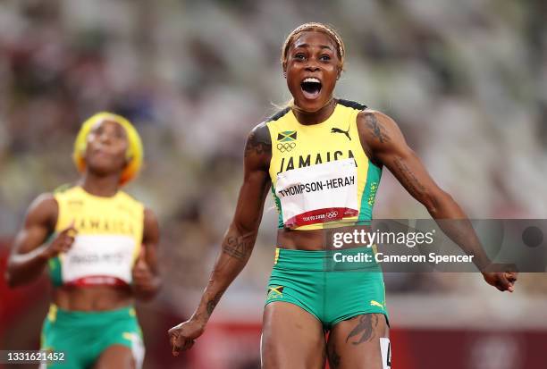 Elaine Thompson-Herah of Team Jamaica celebrates after winning the gold medal in the Women's 100m Final on day eight of the Tokyo 2020 Olympic Games...