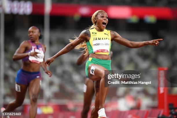 Elaine Thompson-Herah of Team Jamaica celebrates after winning the gold medal in the Women's 100m Final on day eight of the Tokyo 2020 Olympic Games...