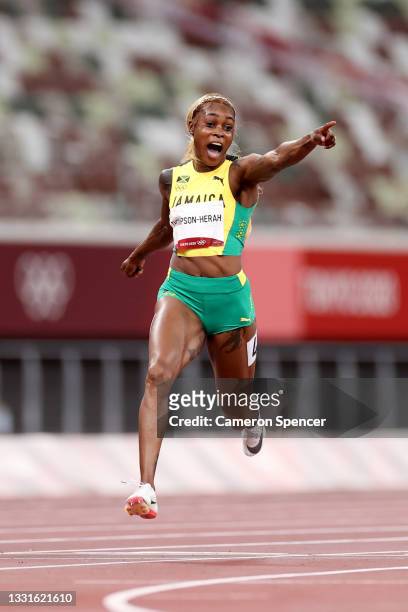 Elaine Thompson-Herah of Team Jamaica celebrates after winning the gold medal in the Women's 100m Final on day eight of the Tokyo 2020 Olympic Games...