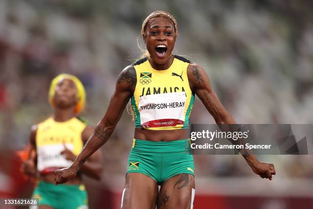 Elaine Thompson-Herah of Team Jamaica celebrates after winning the gold medal in the Women's 100m Final on day eight of the Tokyo 2020 Olympic Games...