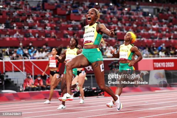 Elaine Thompson-Herah of Team Jamaica crosses the finish line to win the gold medal in the Women's 100m Final on day eight of the Tokyo 2020 Olympic...