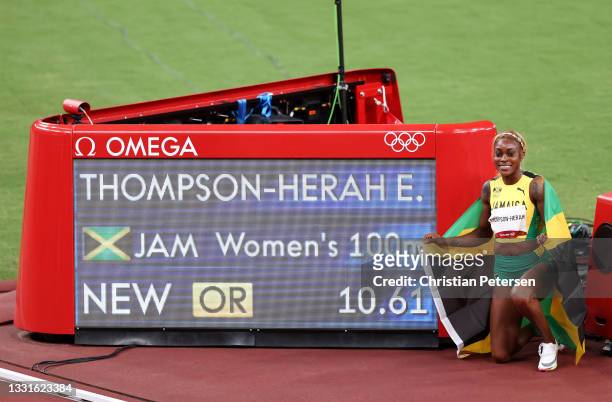 Elaine Thompson-Herah of Team Jamaica poses for a photo after winning the gold medal and setting a new Olympic record in the Women's 100m Final on...