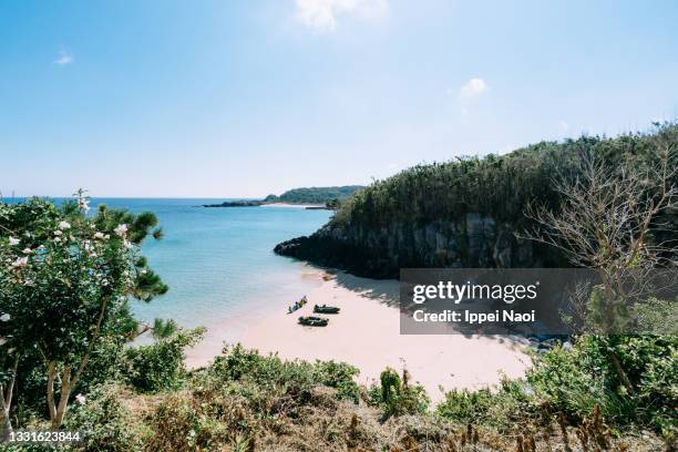 secluded beach with kayaks from above, iki island, nagasaki, japan - satoyama scenery stock-fotos und bilder