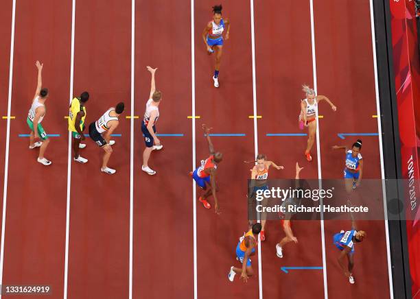 Runners pass their batons in the 4x400m Relay Mixed Final on day eight of the Tokyo 2020 Olympic Games at Olympic Stadium on July 31, 2021 in Tokyo,...