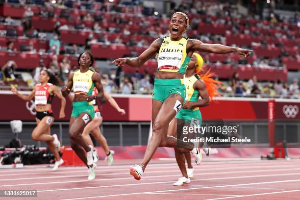 Elaine Thompson-Herah of Team Jamaica celebrates after winning the gold medal in the Women's 100m Final on day eight of the Tokyo 2020 Olympic Games...