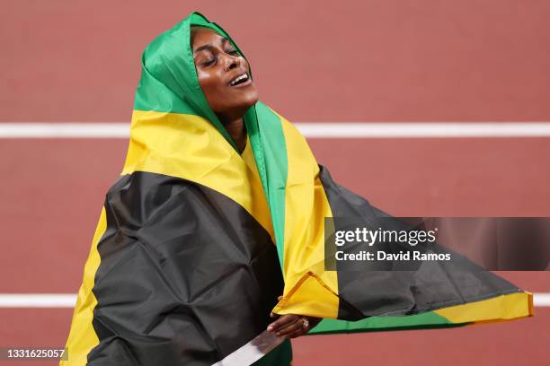 Elaine Thompson-Herah of Team Jamaica celebrates after winning the gold medal in the Women's 100m Final on day eight of the Tokyo 2020 Olympic Games...