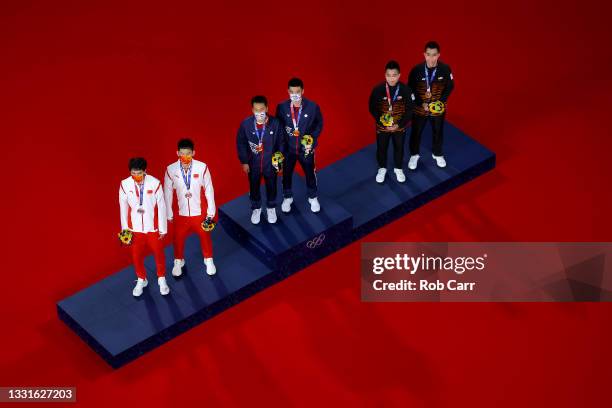 Silver medalists Li Jun Hui and Liu Yu Chen of Team China, gold medalists Lee Yang and Wang Chi-Lin of Team Chinese Taipei and bronze medalists Aaron...