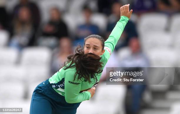 Invincibles bowler Alice Capsey in bowling action during The Hundred match between Northern Superchargers Women and Oval Invincibles Women at Emerald...