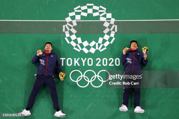 Gold medalists of Men's Doubles badminton event Lee Yang and Wang Chi-Lin of Team Chinese Taipei pose for photo on day eight of the Tokyo 2020...