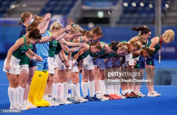 Kathryn Mullan, Captain of Team Ireland and teammates take a bow on pitch following a loss in the Women's Preliminary Pool A match between Ireland...