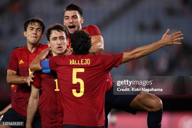 Mikel Oyarzabal of Team Spain celebrates with his team mate after scoring their side's third goal from the penalty spot during the Men's Quarter...