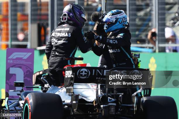 Pole position qualifier Lewis Hamilton of Great Britain and Mercedes GP and second place qualifier Valtteri Bottas of Finland and Mercedes GP...