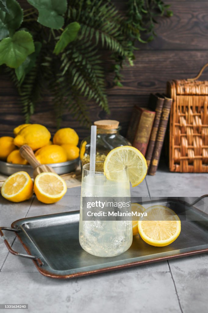 Homemade lemonade in rustic kitchen with fresh lemons