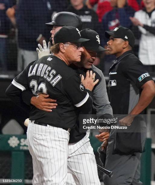 Manager Tony La Russa of the Chicago White Sox is held back by bench coach Miguel Cairo during the eighth inning at Guaranteed Rate Field on July 30,...