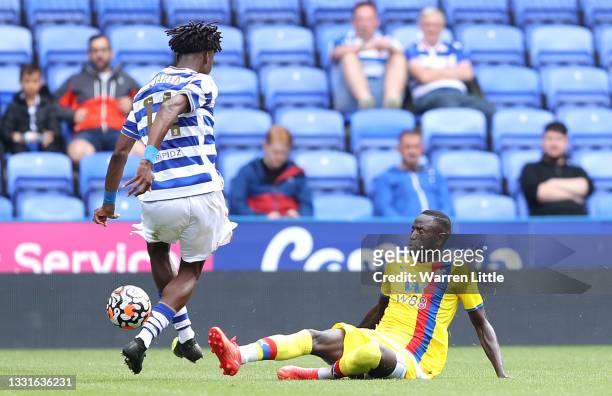 Cheikhou Kouyate of Crystal Palace tackles Ovie Ejaria of Reading FC and receives a red card 11during the pre-season friendly between Reading and...