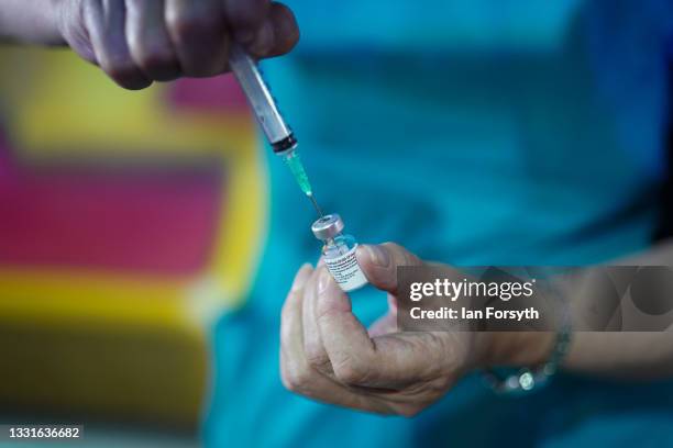 Dr Lisa Pickles draws up the Pfizer-BioNTech COVID-19 vaccine at a new ‘Pop Up’ vaccination centre in the Big Top of Circus Extreme in Shibden Park...