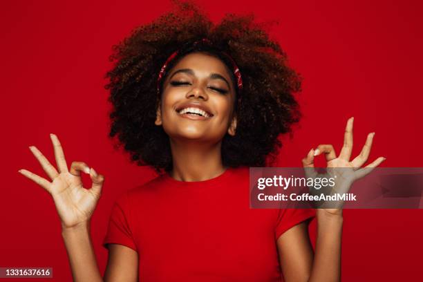 pretty young afro woman - ok hand sign stock pictures, royalty-free photos & images