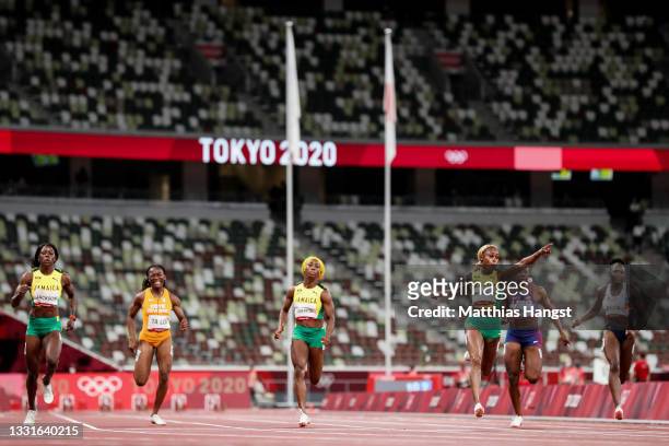 Elaine Thompson-Herah of Team Jamaica celebrates crossing the finish line to win the gold medal in the Women's 100m Final on day eight of the Tokyo...