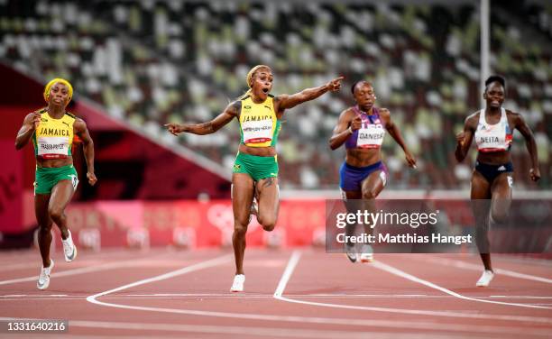 Elaine Thompson-Herah of Team Jamaica celebrates crossing the finish line to win the gold medal in the Women's 100m Final on day eight of the Tokyo...