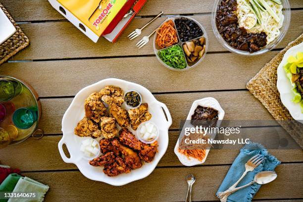 Some of the food court offerings at the H Mart Korean supermarket in Jericho, New York include sweet-and-sour and double-fried chicken, seen here on...