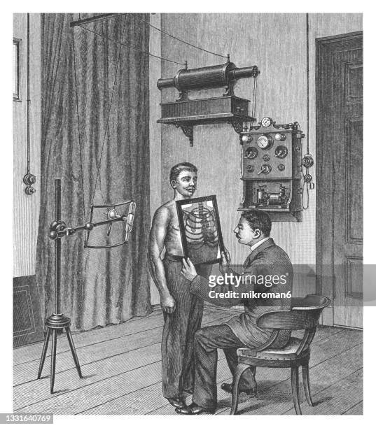 old engraved illustration of early roentgen, x-ray apparatus - röntgen stock pictures, royalty-free photos & images