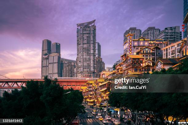 hongyadong hillside buildings and river with bridge in chongqing, china (dusk) - chongqing ストックフォトと画像