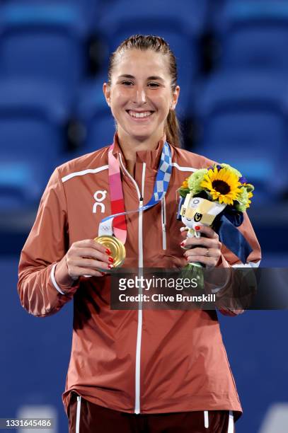 Belinda Bencic of Team Switzerland smiles with her gold medal from the podium during the medal ceremony after defeating Marketa Vondrousova of Team...