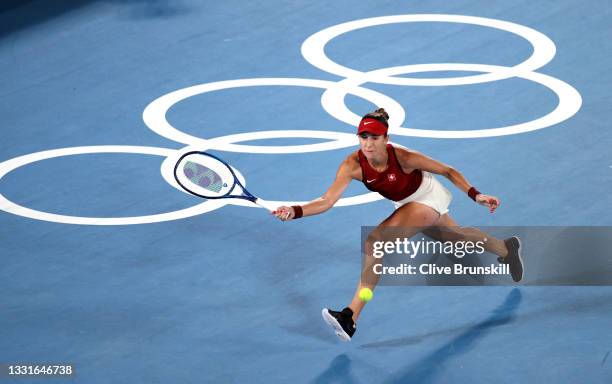 Belinda Bencic of Team Switzerland plays a forehand during her Women's Singles Gold Medal match against Marketa Vondrousova of Team Czech Republic on...