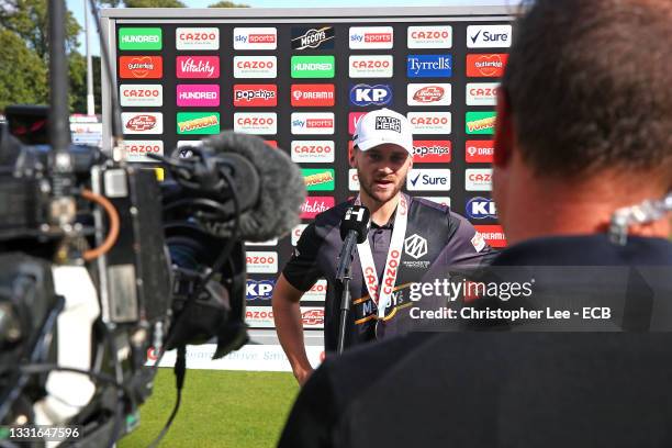 Joe Clarke of Manchester Originals with his Match Hero award is interviewed during The Hundred match between Welsh Fire Men and Manchester Originals...