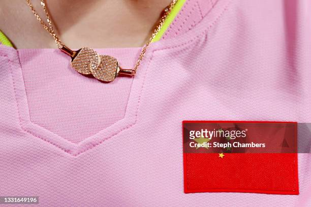 Necklace with a table tennis charm worn by Chen Meng of Team China during her Women's Singles Semifinals match on day six of the Tokyo 2020 Olympic...
