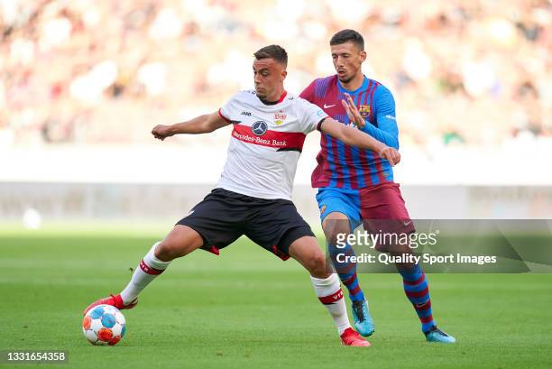 Philipp Forster of Stuttgart competes for the ball with Clement Lenglet of Barcelona during a pre-season friendly match between VfB Stuttgart and FC...