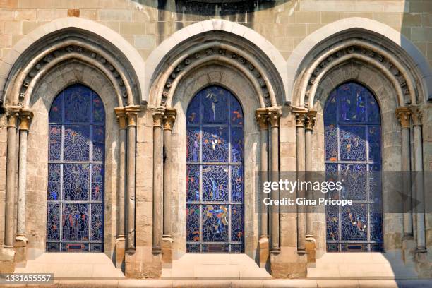 stained glass windows of the cathedral of notre dame in lausanne, switzerland. - arches stock-fotos und bilder