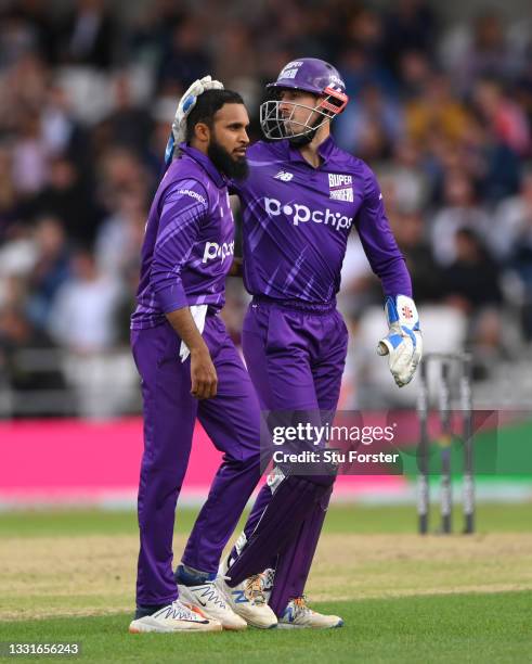 Superchargers bowler Adil Rashid is congratulated after taking the wicket of Laurie Evans during The Hundred match between Northern Superchargers Men...