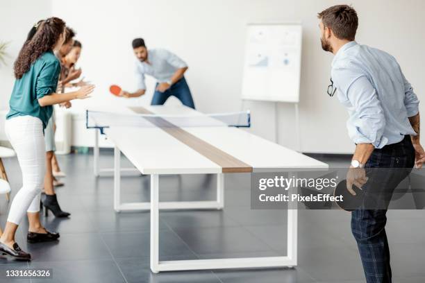 having some fun at the office - office ping pong stock pictures, royalty-free photos & images