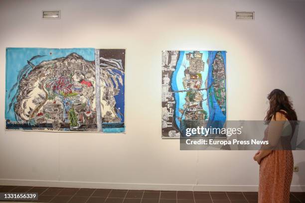 Woman observes one of the works that make up the exhibition 'Catorce relatos breves', at the Casa de Vacas Cultural Center, on July 29 in Madrid,...