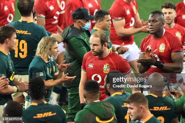 Alun Wyn Jones of British & Irish Lions lead his team off the pitch following defeat during the 2nd Test between South Africa Springboks and British...