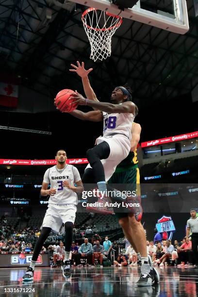 Mike Taylor of the Ghost Ballers attempts a layup while being guarded by Spencer Hawes of the Ball Hogs during BIG3 - Week Four at the American...