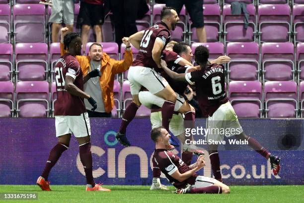 John Souttar of Heart of Midlothian celebrates with teammates after scoring his team's second goal during the Ladbrokes Scottish Premiership match...