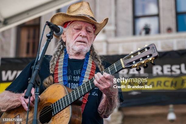 Musician Willie Nelson performs during the Georgetown to Austin March for Democracy rally on July 31, 2021 in Austin, Texas. Texas activists and...