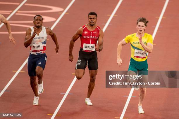 Rohan Browning of Australia in lane one winning heat seven of the 100m preliminary round for men with Kojo Musah of Denmark in lane two and Chijindu...