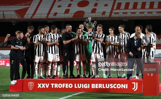 Daniele Rugani of Juventus FC lifts the Luig Berlusconi tropy during the AC Monza v Juventus FC - Trofeo Berlusconi at Stadio Brianteo on July 31,...