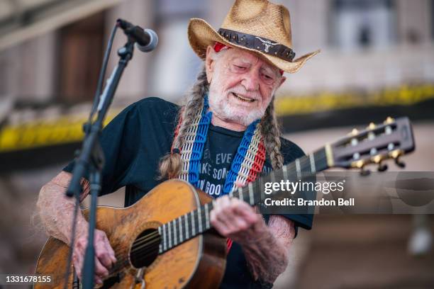 Musician Willie Nelson performs during the Georgetown to Austin March for Democracy rally on July 31, 2021 in Austin, Texas. Texas activists and...