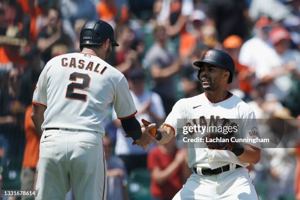 LaMonte Wade Jr of the San Francisco Giants celebrates with Curt Casali after hitting a two-run home run in the bottom of the fourth inning against...