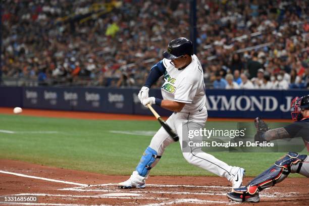 Ji-Man Choi of the Tampa Bay Rays hits a two run home run during the first inning against the Boston Red Sox at Tropicana Field on July 31, 2021 in...