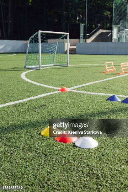 colored chips for marking the football field against the background of the goal - kegel stockfoto's en -beelden