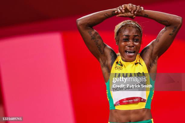 Elaine Thompson-Herah of Team Jamaica celebrates after winning the gold medal in the Women's 100m Final on day eight of the Tokyo 2020 Olympic Games...